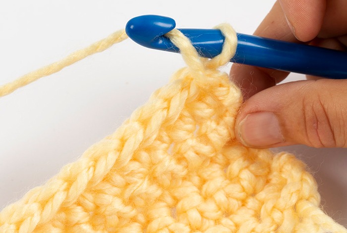 Person crochet a sample